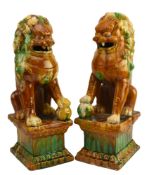 PAIR OF SANCAI GLAZED FU DOGS / GUARDIAN LIONS 三彩狮子一对