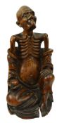 AN EARLY 20TH CENTURY CHINESE HARDWOOD FIGURE OF A LUOHAN 实木雕罗汉像