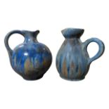 PIERREFONDS, FRANCE - TWO MOTTLED CRYSTALLINE GLAZE HANDLED JUGS