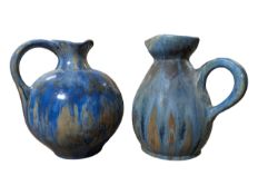 PIERREFONDS, FRANCE - TWO MOTTLED CRYSTALLINE GLAZE HANDLED JUGS