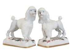 PAIR OF 19TH CENTURY STAFFORDSHIRE POODLE DOG FIGURINES