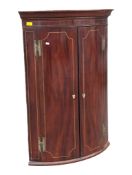 GEORGE III 19TH CENTURY MAHOGANY BOW FRONT INLAID CORNER CABINET
