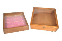 TWO 20TH CENTURY WOODEN AND GLAZED JEWELLERY TABLE TOP CASE CABINETS