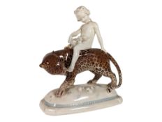 MANNER OF KARL TUTTER (1883 - 1969) - 20TH CENTURY PORCELAIN GIRL ON LEOPARD FIGURE