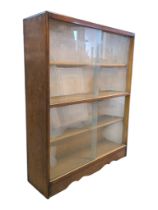 BRITISH MODERN DESIGN - MID 20TH CENTURY TEAK GLAZED FRONT BOOKCASE