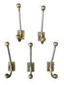 SET OF FIVE 20TH CENTURY STEEL TWO-HOOK ATOMIC STYLE WALL COAT HANGERS