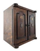 EARLY 20TH CENTURY OAK & EBONISED SMOKER'S CABINET IN THE FORM OF A SAFE