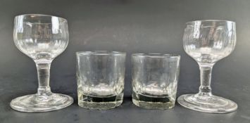 FOUR 18TH & 19TH CENTURY HAND BLOWN FIRING AND PENNY LICK SHOT DRINKING GLASSES