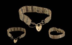 Ladies - Quality 9ct Gold Nine Bar Gate Bracelet with Heart Shaped Padlock. Marked 9.375.