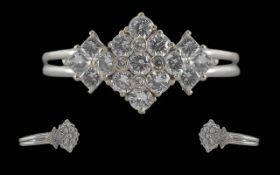 Ladies Superb Contemporary Diamond Set Platinum Ring, marked 950 Platinum. The well-matched modern