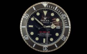 Rolex Style Dealer Display Wall Clock, black face, cream markers, date aperture, marked Sea Dweller,