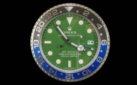 Fashion Display Wall Clock, dark green face, cream markers, date aperture, marked GMT Master II,