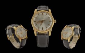 Omega - Automatic Gents 18ct Gold Cased Wrist Watch. Features Pearl Coloured Dial, Gold Markers,