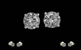 Ladies Fine Pair of 18ct White Gold Diamond Stud Earrings. Each Modern Brilliant Cut Diamonds of