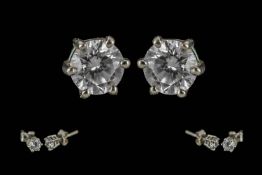 Ladies Fine Pair of 18ct Gold Diamond Set Stud Earrings. Marked 18ct. The Modern Round Brilliant Cut