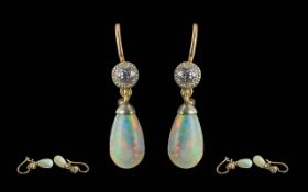 Ladies Fine Pair of 9ct Gold Diamond and Opal Set Earrings. The Opal Tear Drops of Good Colour.