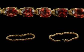 Ladies 10ct Pleasing Fire Garnet Set Bracelet, Marked 10 ct. Well Matched Garnets of Good Colour /
