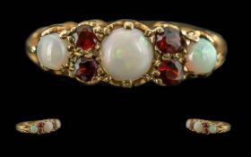 Antique Period - Pleasing Ladies 9ct Gold Garnet and Opal Set Ring, Raised Open worked Setting, Full