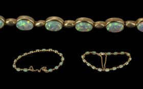 Ladies Attractive 9ct Gold Opal Set Bracelet with Safety Chain, Marked for 9ct. Well Matched Opals