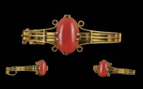 Victorian Period 1837 - 1901 Ladies 15ct Gold Hinged Bangle Set with a Large Oval Shaped Coral Stone