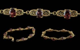 Ladies 10ct Gold Ruby Set Bracelet, Ornate Setting. Marked 10ct. Well Matched Rubies of Good Colour.