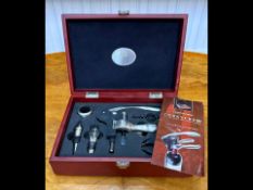 Unused Corkscrew, Bottle Opener, Bottle Stopper Ect... - Housed in a mahogany effect box.