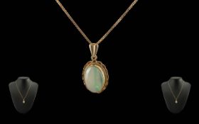 Ladies - Pleasing 9ct Gold Opal Set Pendant Attached to a 9ct Gold Box Chain. Marked 9ct. Opal of