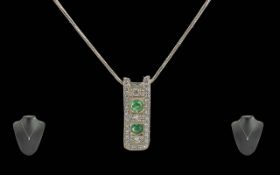 Ladies - Pleasing Quality 18ct White Gold Diamond and Emerald Set Pendant and Integral Chain, Marked