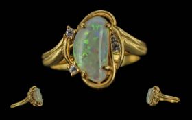 Ladies 18ct Gold Fine Opal and Diamond Set Ring, Marked 750 - 18ct to Shank. The Opal of Pleasing