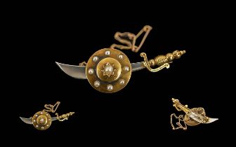 Antique Period - Novelty 15ct Gold Sabre and Shield Brooch with Safety Chain.