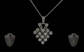 Ladies Attractive 18ct White Gold Diamond Set Pendant Attached to a 18ct White Gold Chain.