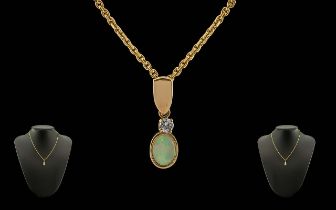 Ladies Attractive Opal and Diamond Set Pendant Attached to a 9ct Gold Chain. Both Marked for 9ct.