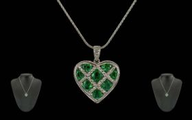 Ladies 18ct White Gold Emerald and Diamond Set Heart Shaped Pendant. Marked 750 - 18ct.