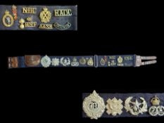 Good Collection of Cap Badges on a Leath