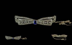 Ladies 1920's 18ct White Gold Diamond and Sapphire Set Ribbon Bow Brooch. Tests 18ct. The Central