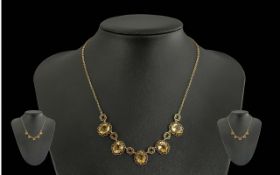 9ct Gold Necklace, set with five oval Citrines, early 20th century. Gross weight 8.9 grams.