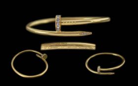 Cartier - a 'Juste un Clou' Diamond-set bracelet in 18ct yellow gold, classic model, of a hinged