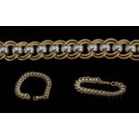 A Fine Quality 9ct Two Tone Gold Roll-a-ball Design Bracelet. With Gold Marks for 9ct. Pleasing