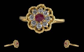 Ladies 18ct Gold Pleasing Diamond and Ruby Set Dress Ring, Flower head Design, Marked 18ct to Shank.
