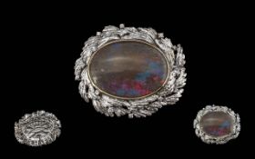Black Opal Brooch. Large Black Opal 30 x 22mm, Set In White Metal stamped 18K, Gross weight 22