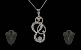 Ladies - Attractive and Exquisite 18ct White Gold Diamond Set Pendant of Pleasing Design. Marked