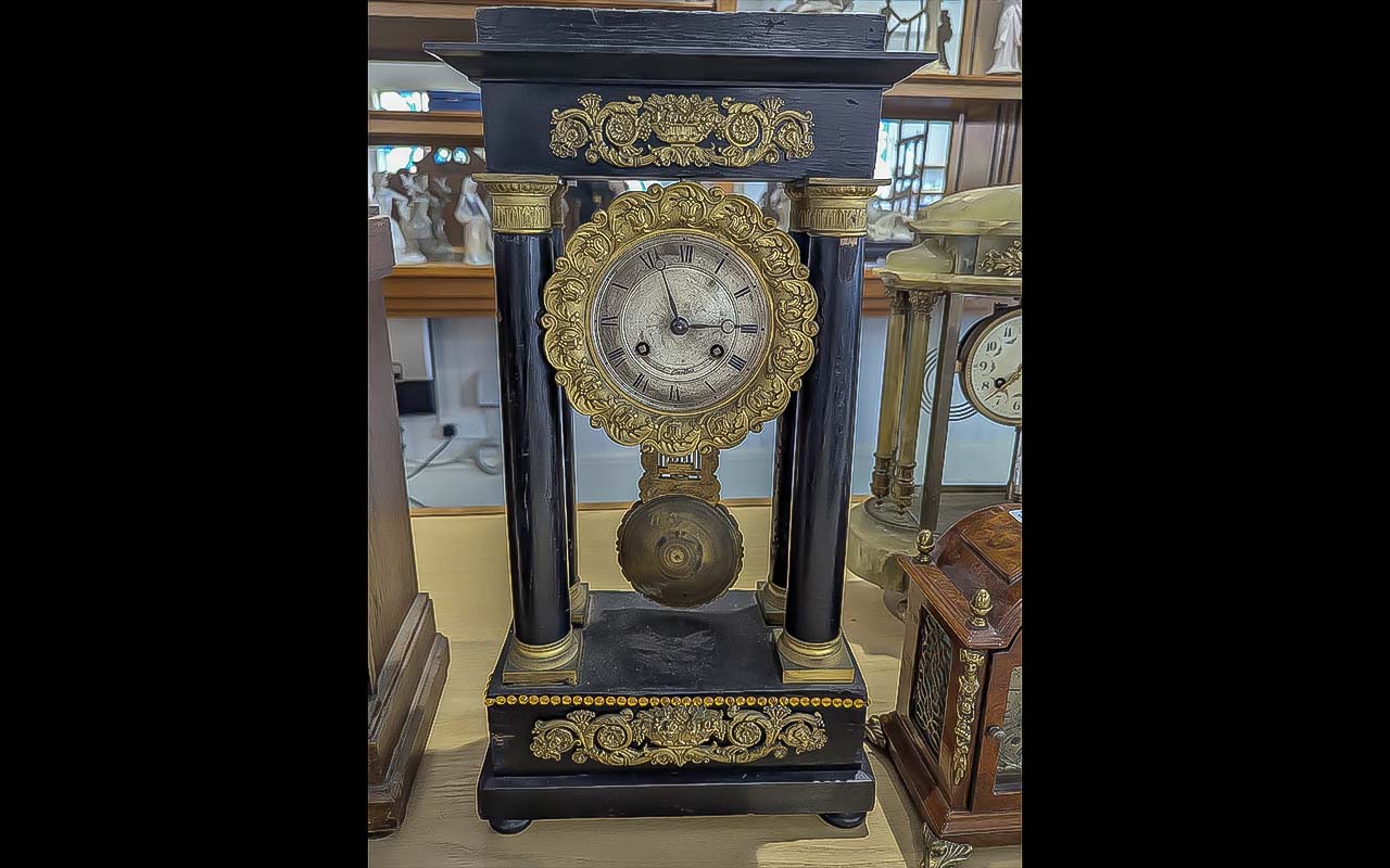 French Napoleon Portico Empire Style Clock, gilt metal face, side columns. Height 19''.
