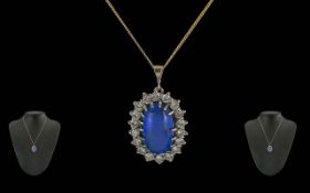 Ladies Fine Quality 18ct White Gold Mounted Black Opal and Diamond Set Oval Shaped Pendant. The