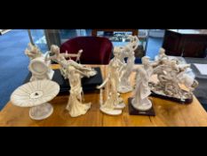 Collection of Seven Resin Figures, to include reclining figure resting on top of a wooden plinth,