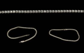 18ct White Gold Line Bracelet - Set With White Faceted Stones. Marked 18ct. Gross Weight 6.5 Grams.