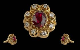Ladies 18ct Gold Ruby and Diamond Set Cluster Ring. Marked 18ct to Interior of Shank. The Central