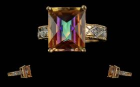Ladies Pleasing 14ct Gold Mystic Topaz Set Ring with Diamond Set Shoulders, Marked 14ct to Shank.