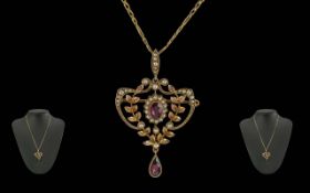 Antique Period Ladies 9ct Gold Pleasing Open worked Pendant, set with seed pearls and garnets.