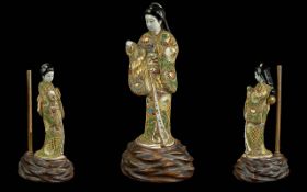Antique Japanese Satsuma Figure of a girl in fine clothing,