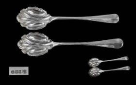 A Fine Boxed Pair of Sterling Silver Serving Fruit Spoons with Fluted Bowls,